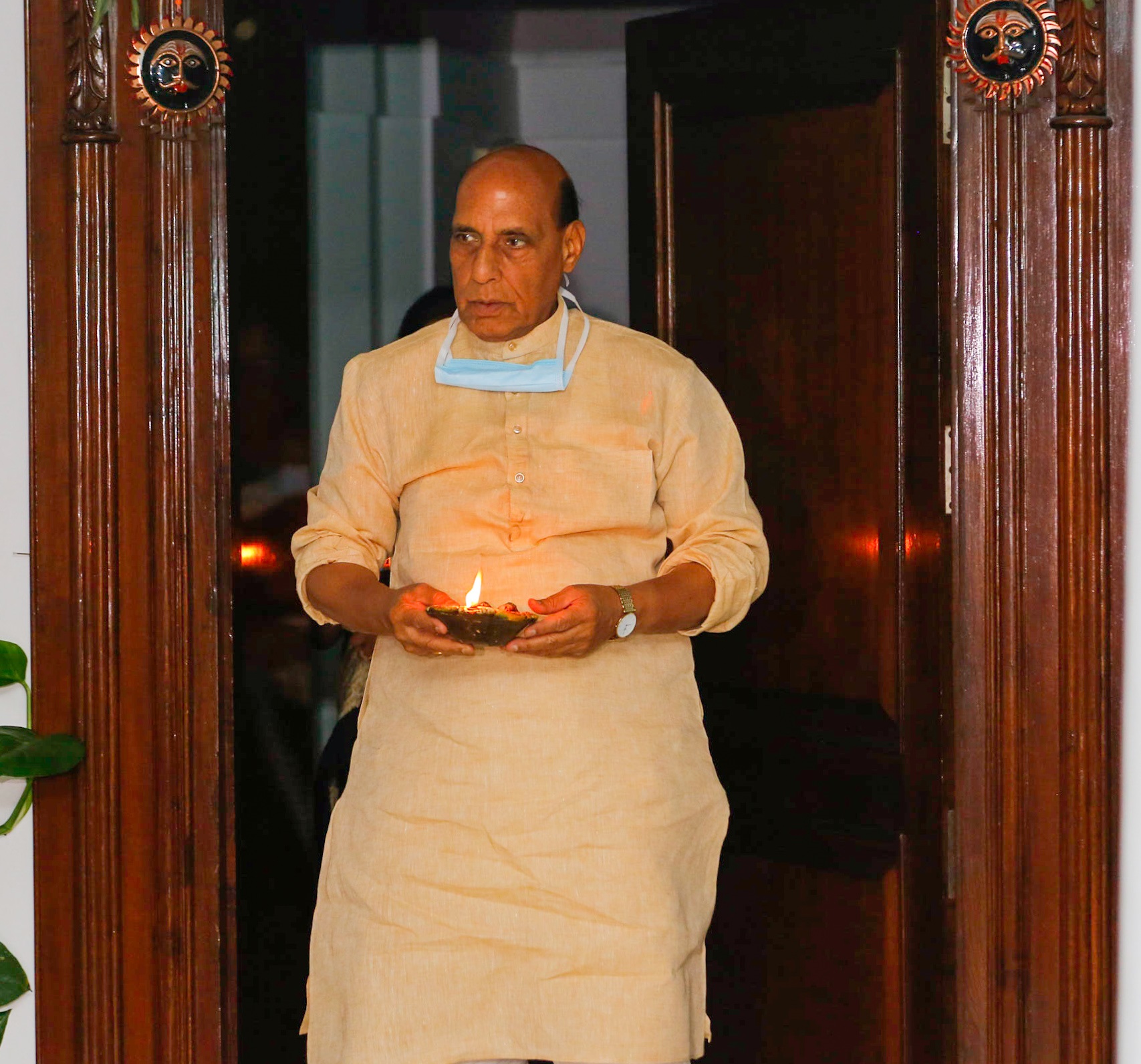 Raksha Mantri Shri Rajnath Singh joins the nation by lighting lamps for nine minutes at 09:00 PM expressing his solidarity to fight COVID-19, on a call given by Prime Minister Shri Narendra Modi, in New Delhi on Sunday, April 05, 2020