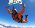 Sky diving carrying Indian National Flag over Andes Mountain Region in Santiago